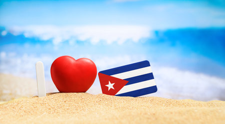 Flag of Cuba on the beach with a red heart. vacation and travel concept.の写真素材