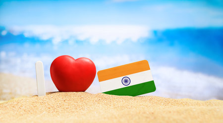 I love India. Flag of India on the beach with a red heart. vacation and travel concept.の写真素材