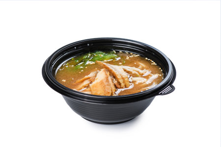 Soup with seafood in a disposable plate on a white background. food delivery conceptの写真素材