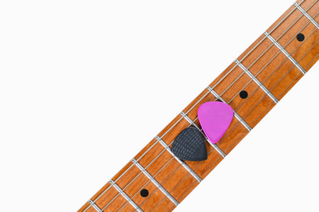 Electric guitar neck and picks on white background. close-up, free spaceの写真素材