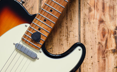 Pick and rock guitar on wooden background. close-up, selective focus. Music and creativity conceptの写真素材