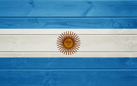 Flag of Argentina on old wooden surface.の写真素材
