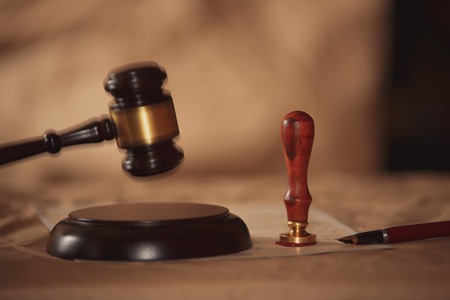 Judge gavel with lawyers advice legal at law firm in background. Concepts of law.の写真素材