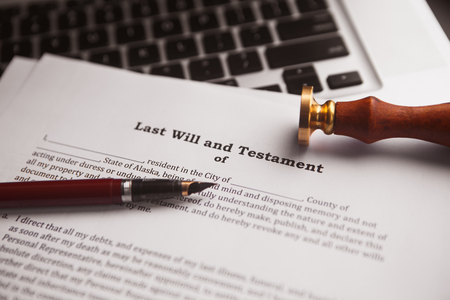 Notarys public pen and stamp on testament and last will.の写真素材