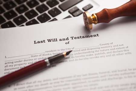 Notarys public pen and stamp on testament and last will.の写真素材