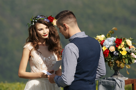 White flowers decorations during outdoor wedding ceremonyの写真素材