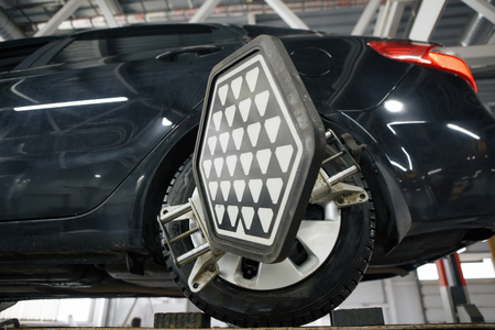 The machine is on a lift , auto repair service station backgroundの写真素材