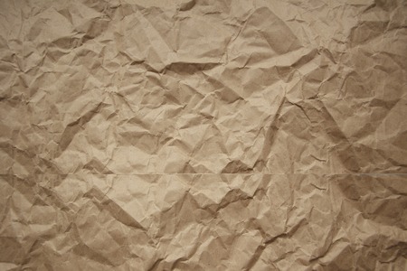 Brown rough crumpled recycled paper textureの写真素材