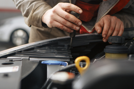 Technicians are checking car engines.の写真素材