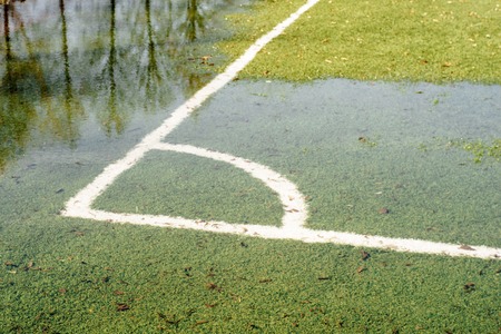 A flooded soccer field after heavy rainの写真素材