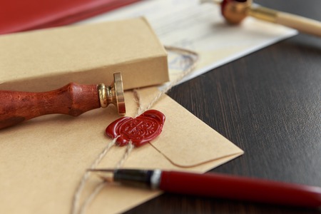 Notarys public pen and stamp on testament and last will. Notary public tools