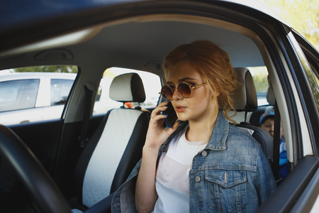 Angry young woman in carの写真素材