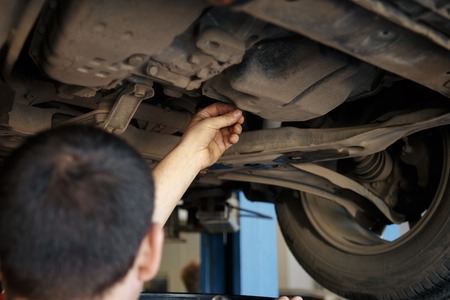 Portrait of a mechanic at work in his garageの写真素材