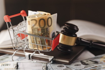 Judge or auction gavel and basket euro banknotes on black backgroundの写真素材