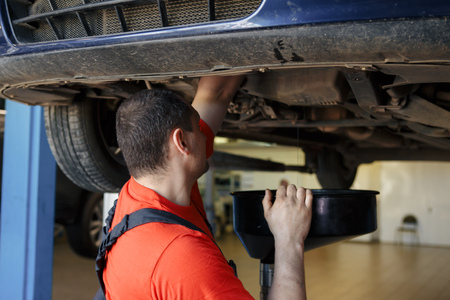 Mechanic at work in his garageの写真素材