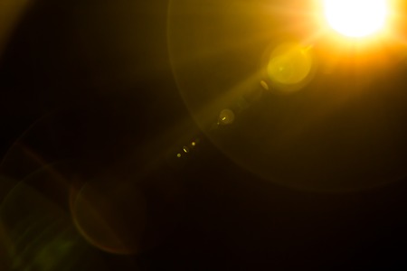 Abstract Natural Sun flare on the blackの写真素材