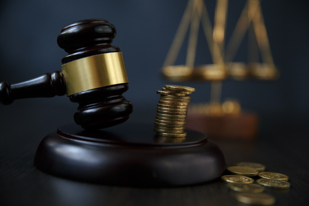 legal gavel and coins in a coin jarの写真素材