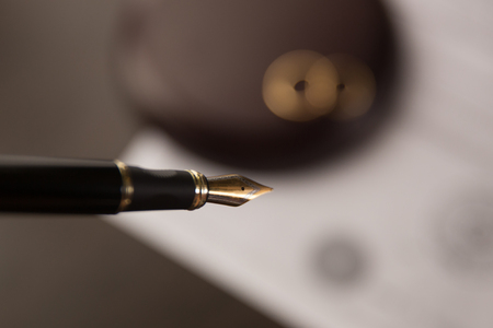 Hands of wife, husband signing decree of divorce, dissolution, canceling marriage, legal separation documents, filing divorce papers or premarital agreement prepared byの写真素材