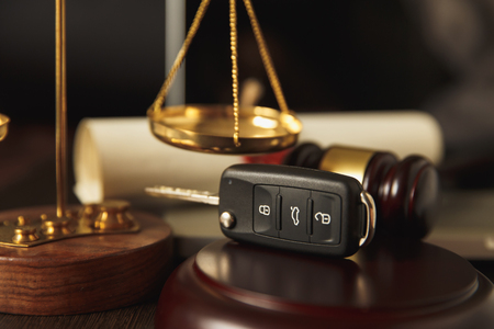 Close up of judge gavel and car keys overの写真素材