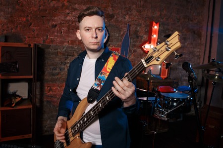 a bassist plays at a live concert