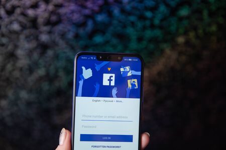 Tula, Russia - November 28, 2018: Facebook social media app logo on log-in, sign-up registration page on mobile app screen on smart devices in business persons hand at workのeditorial素材