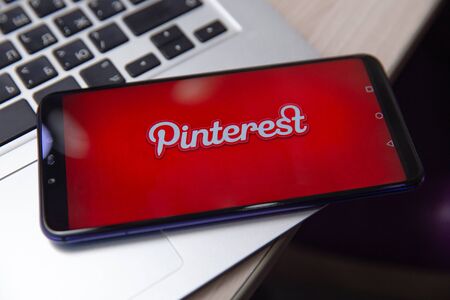 Tula, Russia - November 28, 2018: Woman holding with app on the screen. Pinterest is an online...