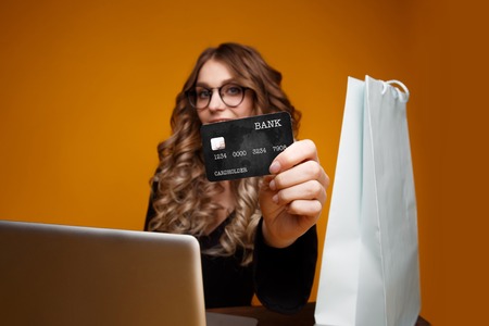 Photo of handsome woman with black credit cardの写真素材