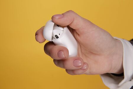 Tula, Russia - JANUARY 24, 2019: Happy woman listening music Apple AirPodsのeditorial素材