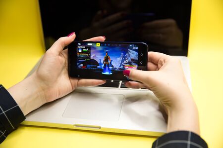 Tula, Russia - JANUARY 27, 2019 - Fortnite video game screen with character and console controller....