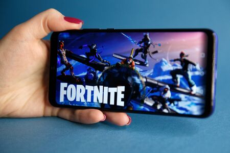 Tula, Russia - JANUARY 27, 2019 - Fortnite video game screen with character and console controller....