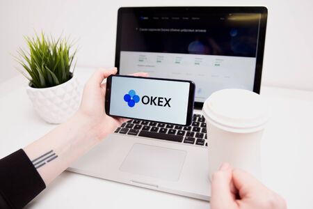 Tula, Russia - February 18, 2019: OKEx logo displayed on a modernのeditorial素材