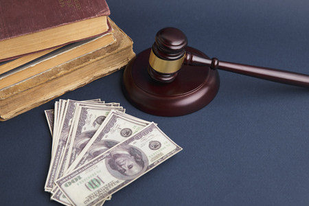 Judge wooden gavel with dollar money banknote concept forの写真素材