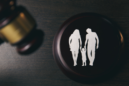 Family figure and gavel on table. Family lawの写真素材