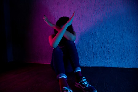 young scared and helpless Asian Korean woman horrified suffering domestic violence victim of abuse...