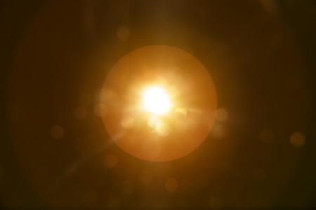 Abstract Natural Sun flare on the blackの写真素材