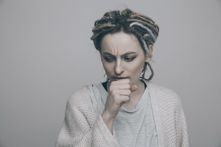 Woman feeling sick. Sore throat.の写真素材