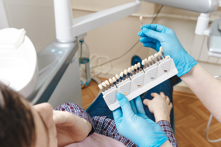 Pallet for tooth. Process of choosingの写真素材