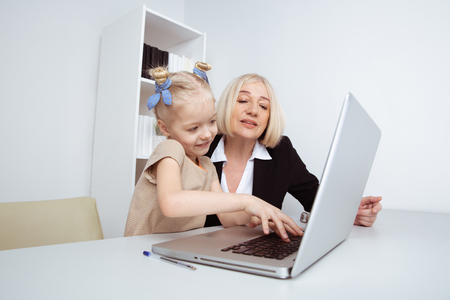 Woman counseling little girl indoor in the room. Psychologist concept.の写真素材