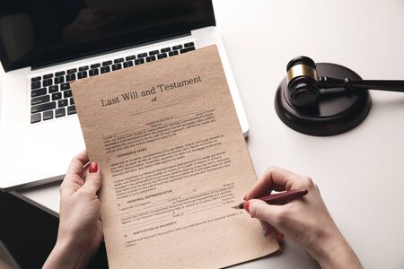 Notary paper concept. Documents in woman's handsの写真素材