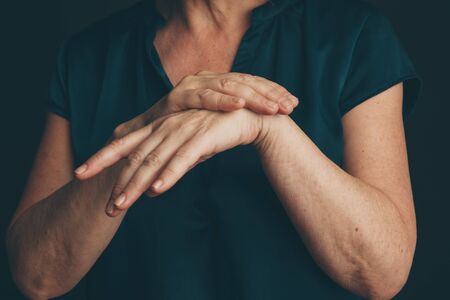 Wrist pain concept. Womans hands.の写真素材