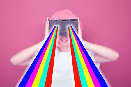 Young girl 90s and VHS cassette on pink