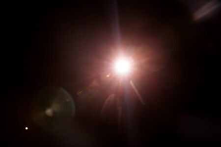 Abstract Natural Sun flare on the blackの写真素材