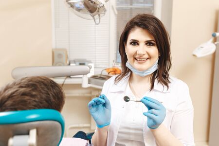 Dentist and male patient in the dental room.の写真素材