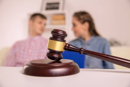 Judge gavel deciding on marriage divorce in office of lawyerの写真素材