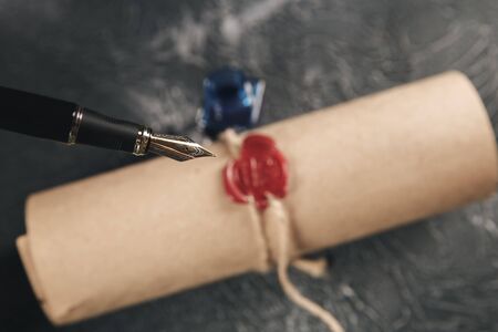 Red wax stamp on the paper document isolated.の写真素材