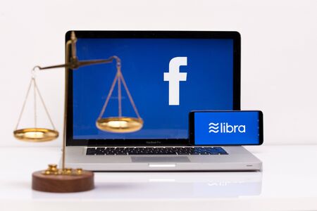 Tula 2.08.2019 Libra Facebook on the phone and computer screen.