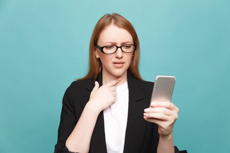 Stressed unhappy woman with phone. Bad news concept.