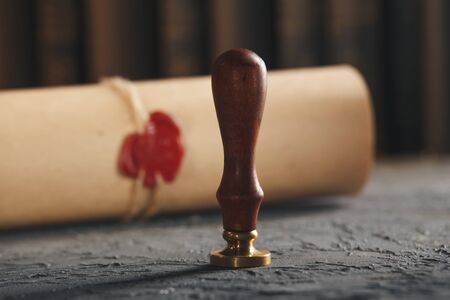 Red wax stamp on the paper document isolated.