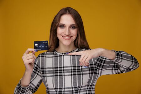 Woman showing credit card. Purchase online concept.の写真素材