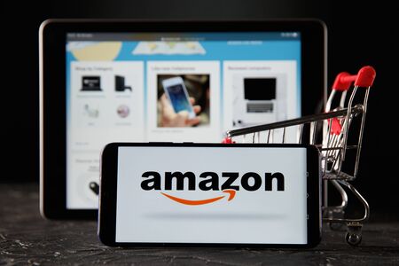 Tula 24 09 2019: amazon on the tablet and phone display.のeditorial素材